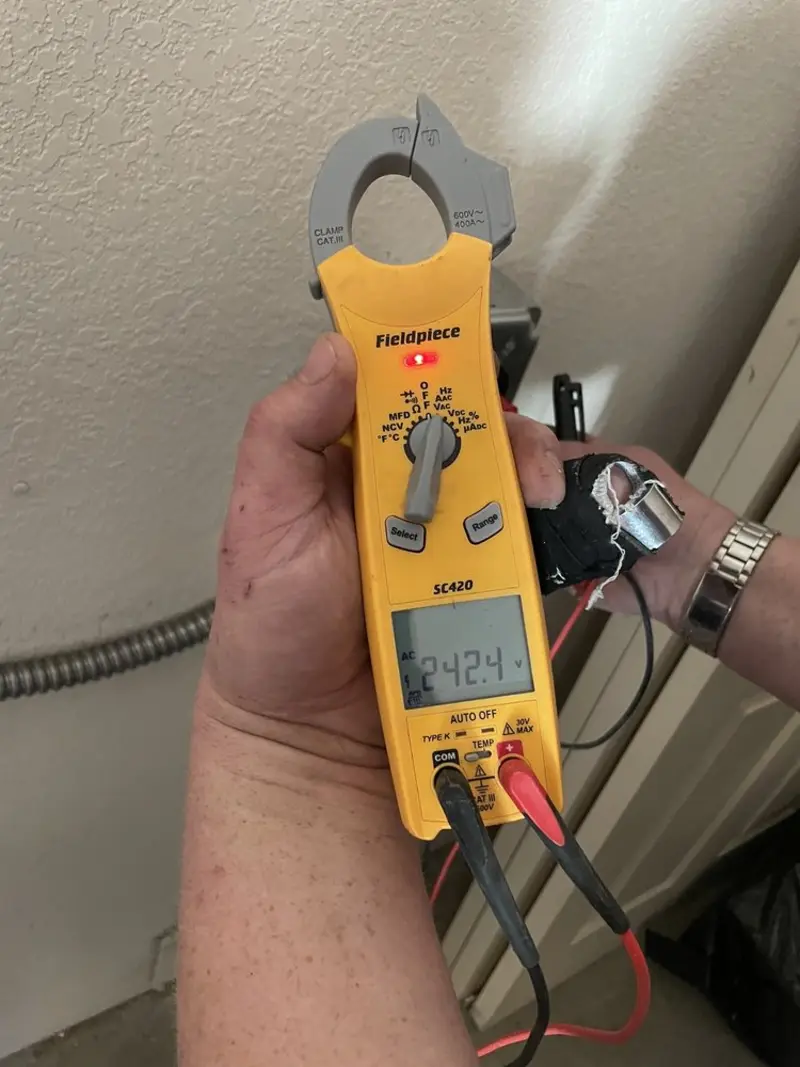Voltage testing with clamp meter during Electrical Installation Services in Rockwood